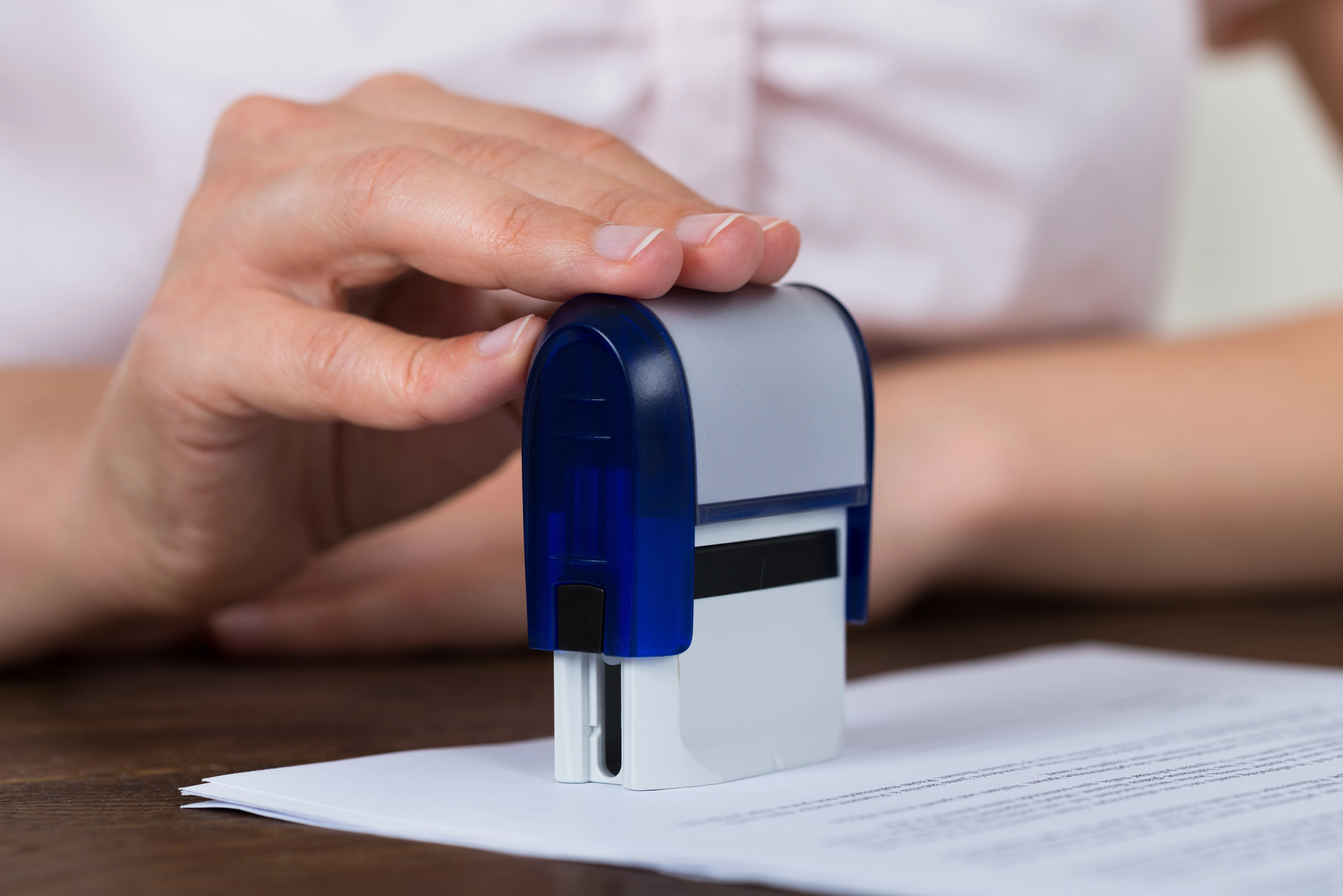 Notary public notarizing a legal document